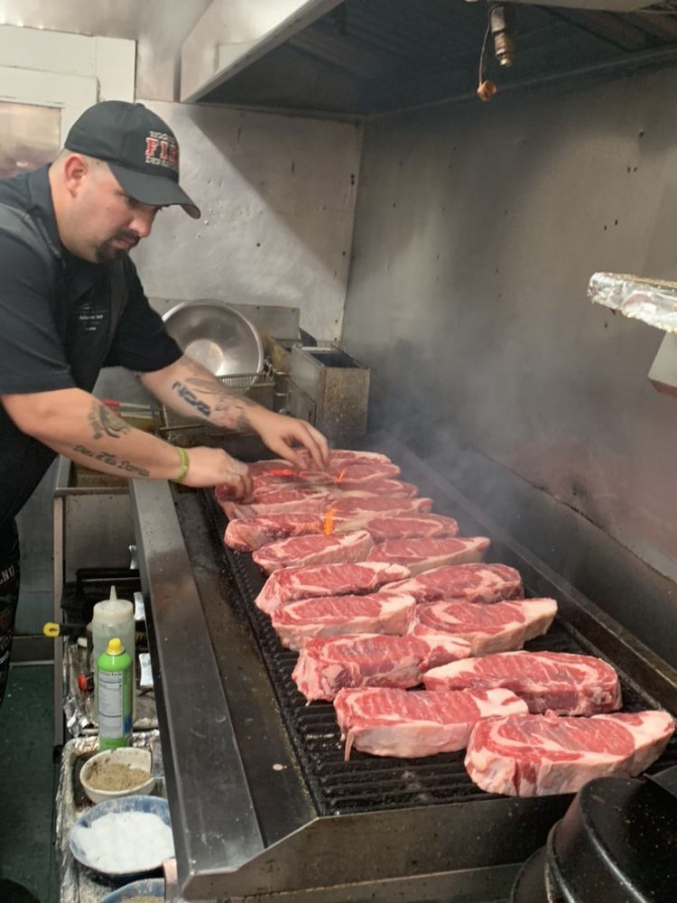 Summervilles Bar and Restaurant Man Cooking Ribeye